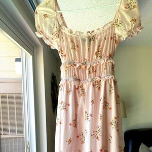 Francesca’s floral pink midi dress with smocked waist.